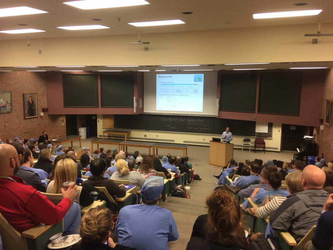 Jon Wanderer, MD, MPhil, goes over eStar training with department members in a packed auditorium. 